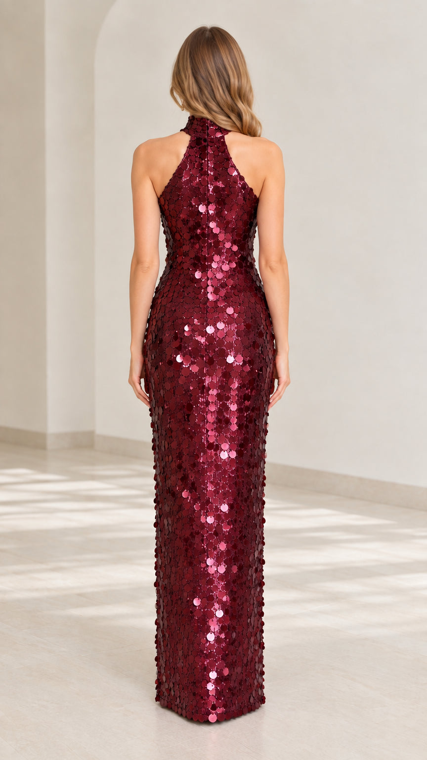 Back view of model wearing burgundy sequin halter maxi dress