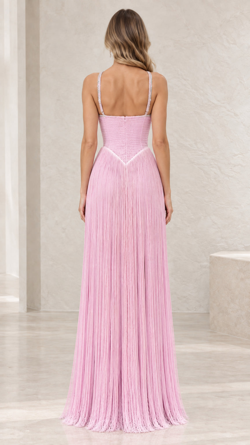 Back view of pink basque waist halter fringe gown