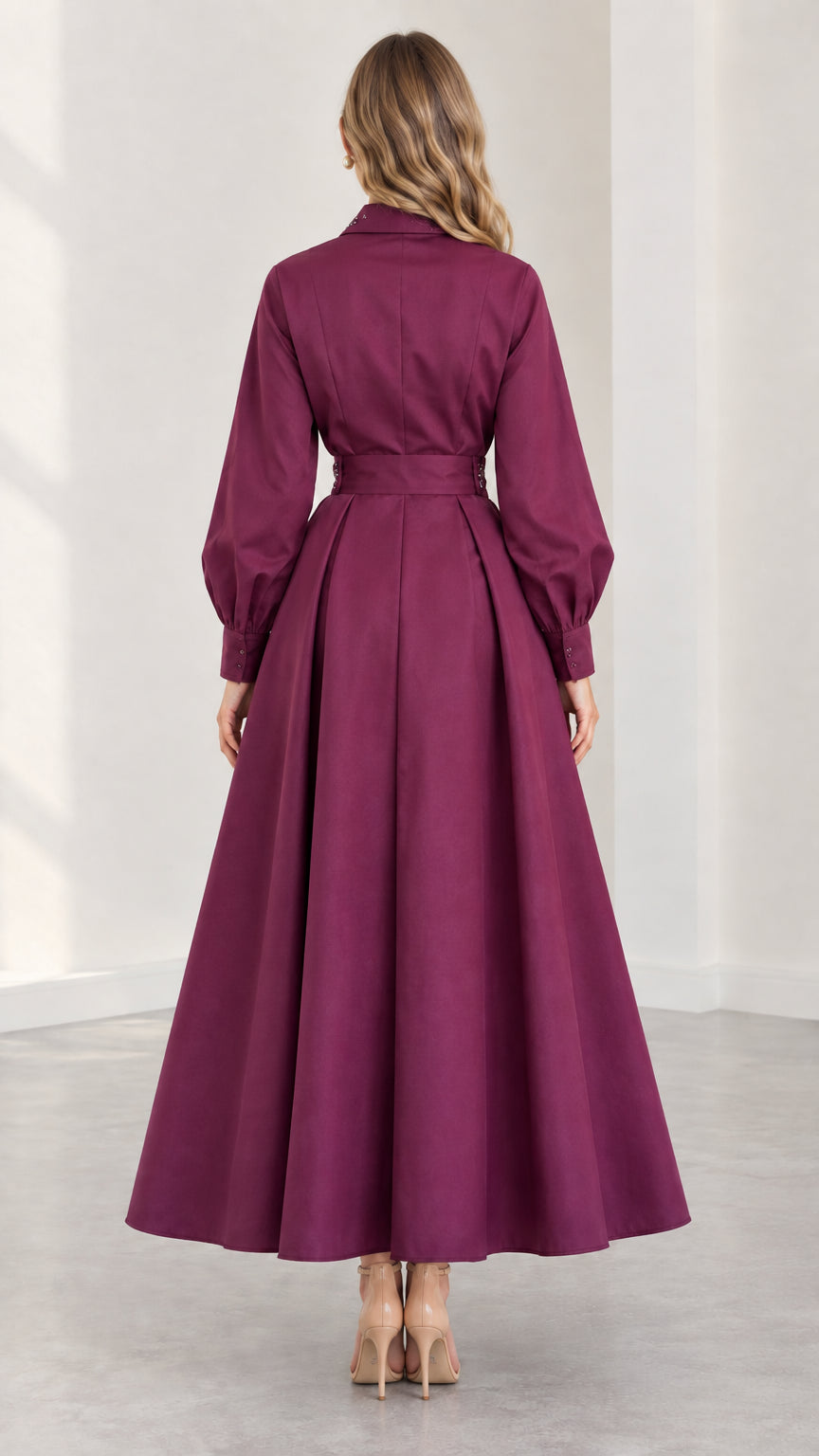 Back view of plum long sleeve maxi dress showing flared skirt silhouette