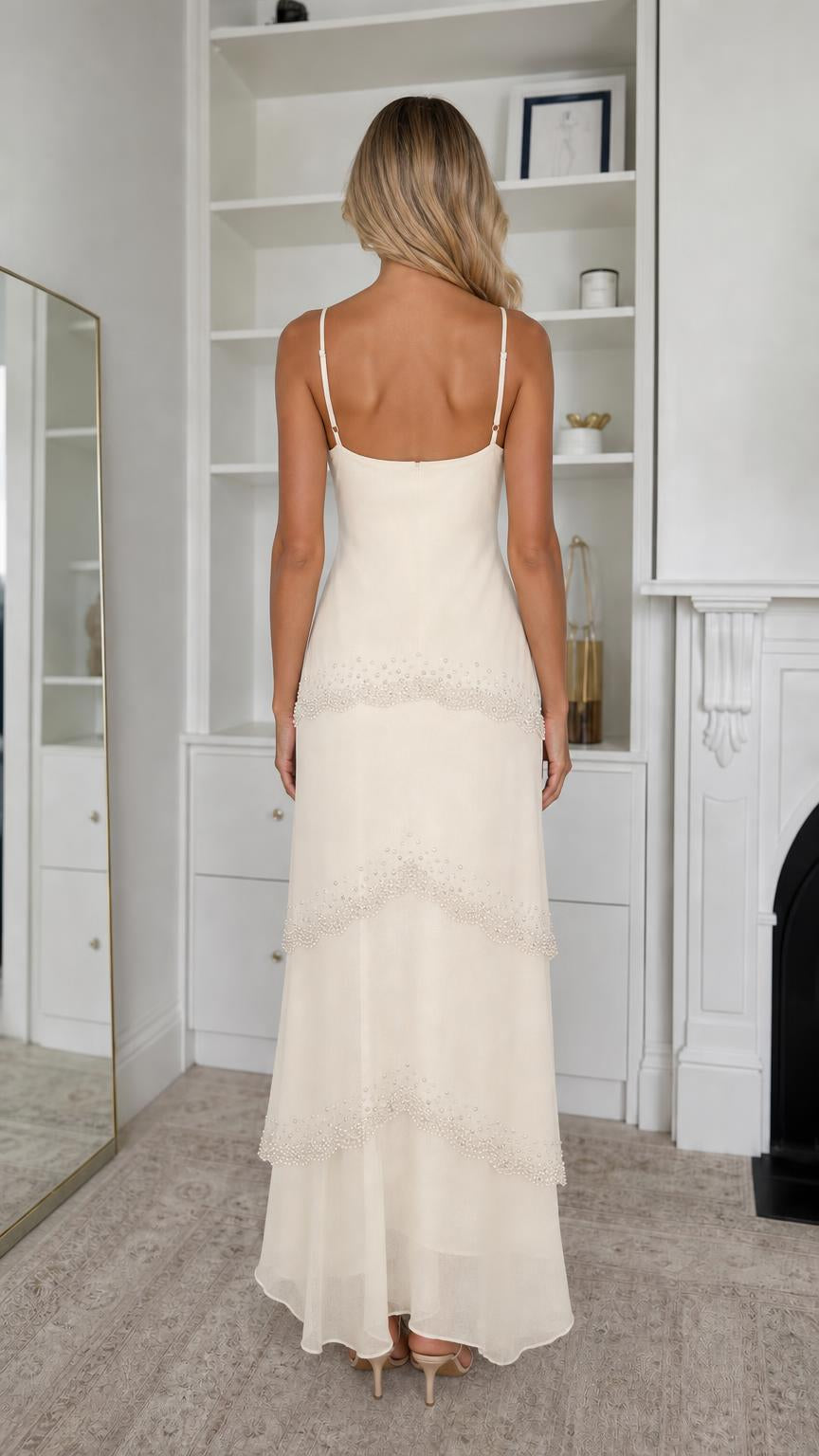 Back view of champagne maxi dress showing spaghetti straps