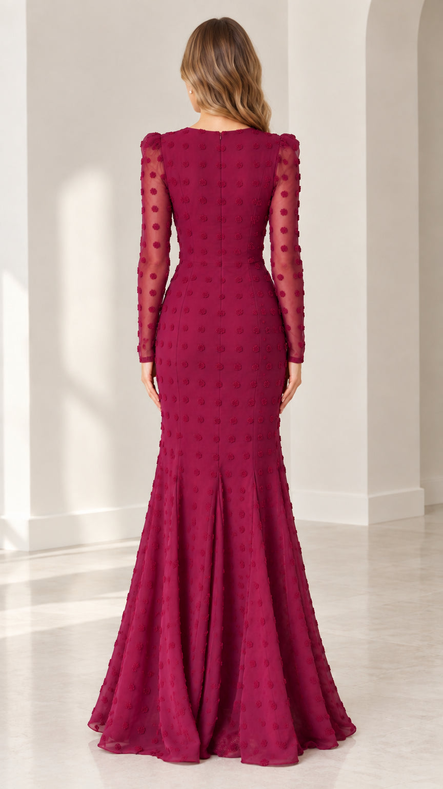 Back view of burgundy mermaid gown showing hidden zipper and flared lower skirt