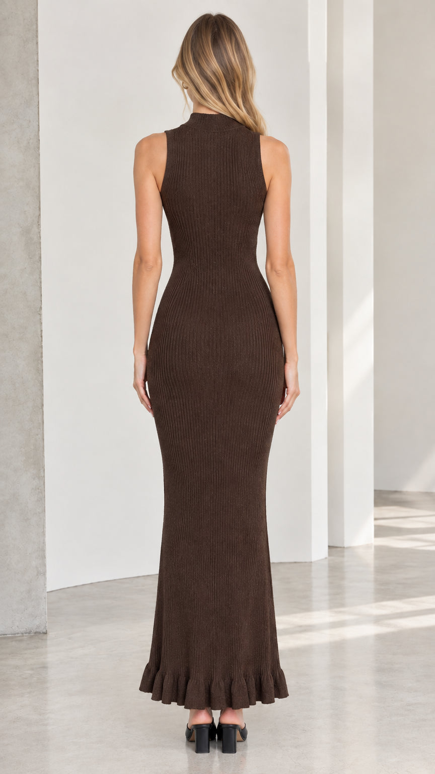Model wearing brown sleeveless mock neck maxi dress back view