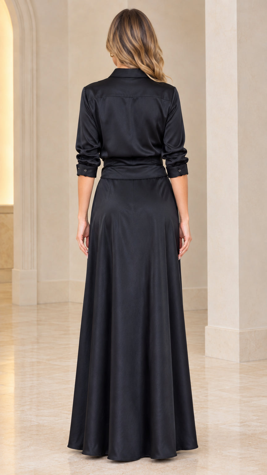 Back view of model in black satin floor-length shirt dress