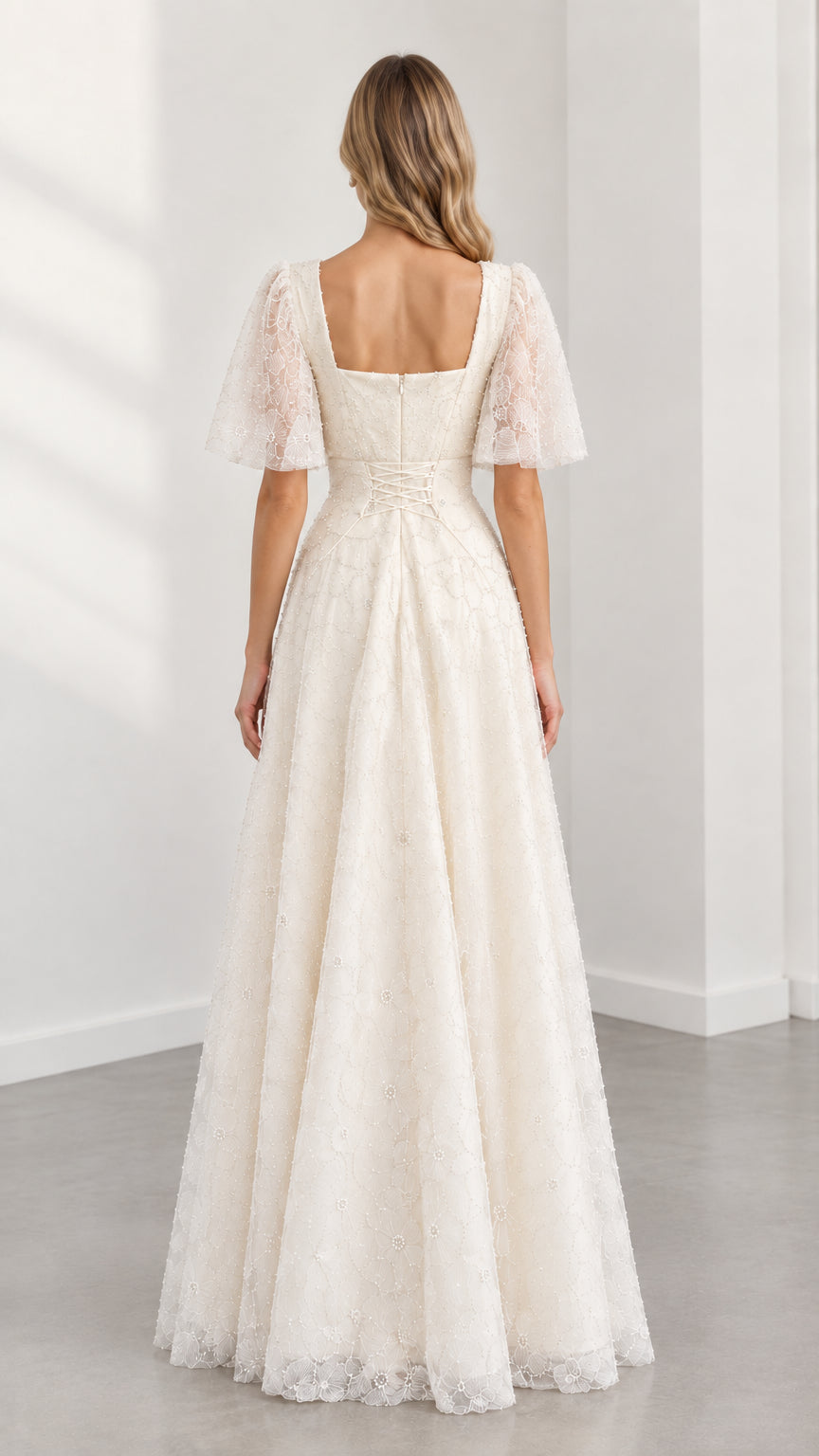 Back view of cream square back formal maxi dress showing fitted waist