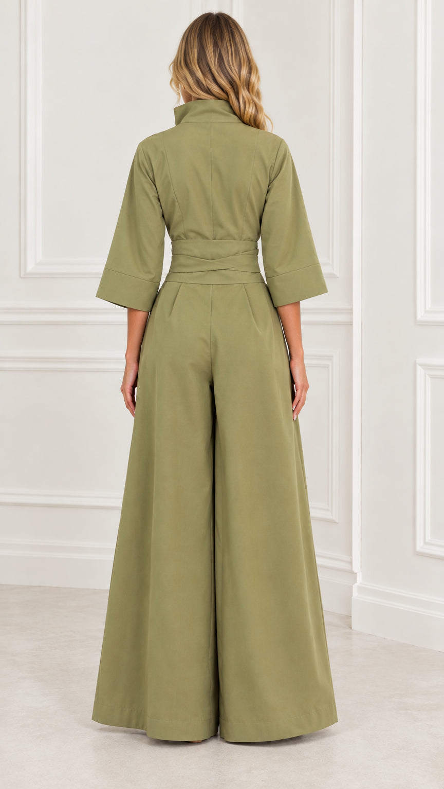 Back view of woman wearing an olive green wide-leg jumpsuit