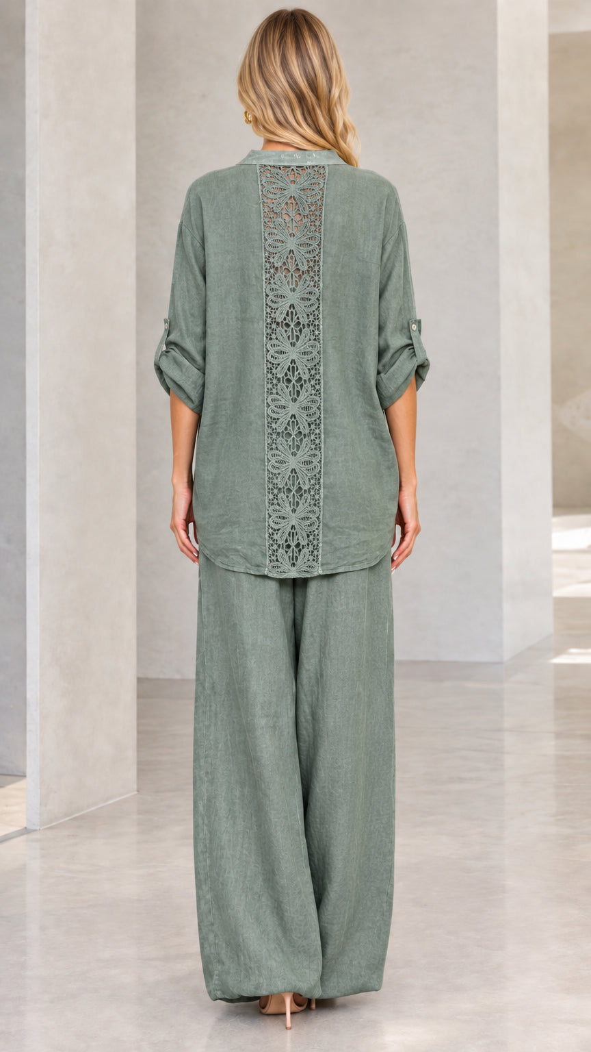 Back view of sage green tunic shirt highlighting vertical crochet lace insert