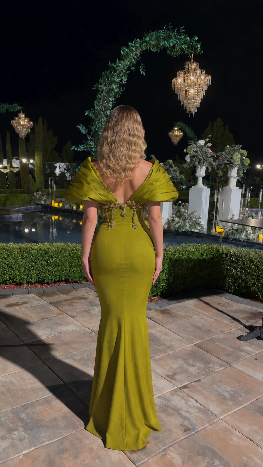 Back view of olive green low-back evening dress showing sculpted pleated shoulders