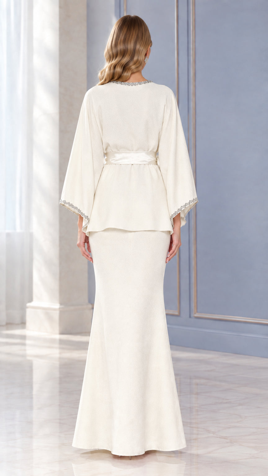 Back view of Ivory two-piece evening set showing drape and fit