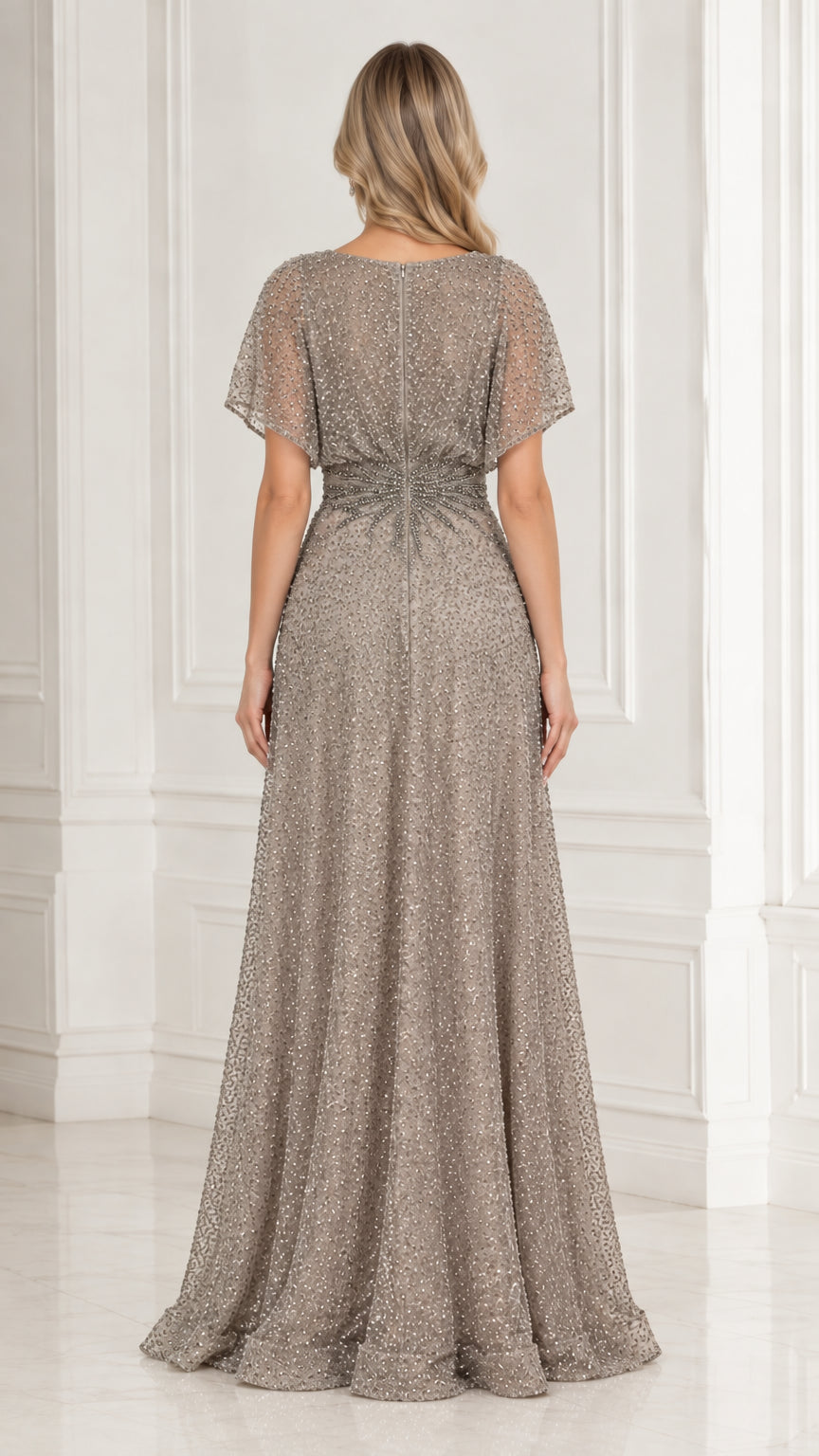 Back view of model in elegant taupe beaded floor-length formal dress