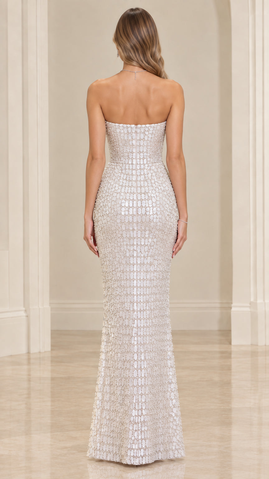 Back view of model wearing Ivory strapless sequin maxi gown