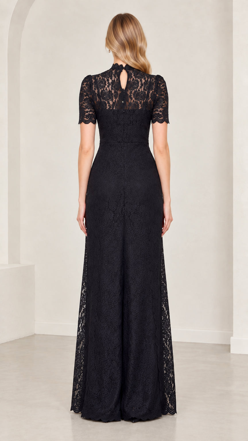 Back full-length view of model in black lace jumpsuit showing back keyhole detail