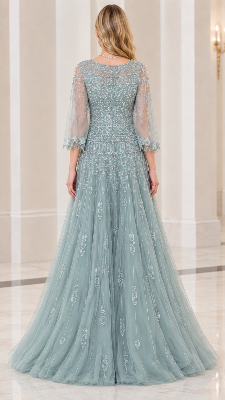 Back view of dusty blue embellished tulle formal gown showing neckline and skirt drape