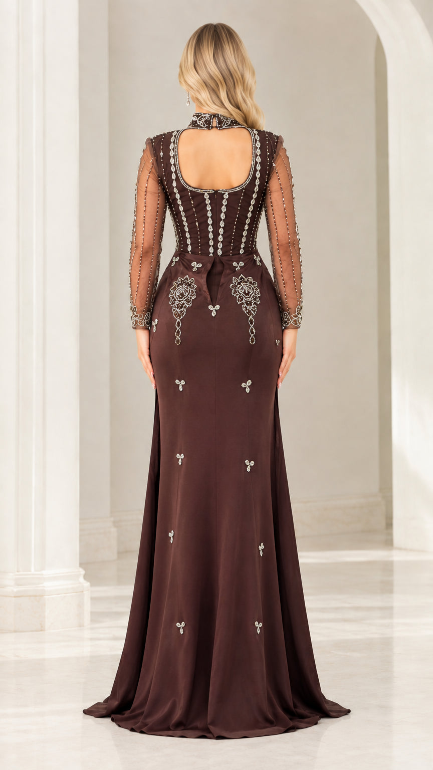 Back view of chocolate brown gown showcasing keyhole cutout back and beaded accents