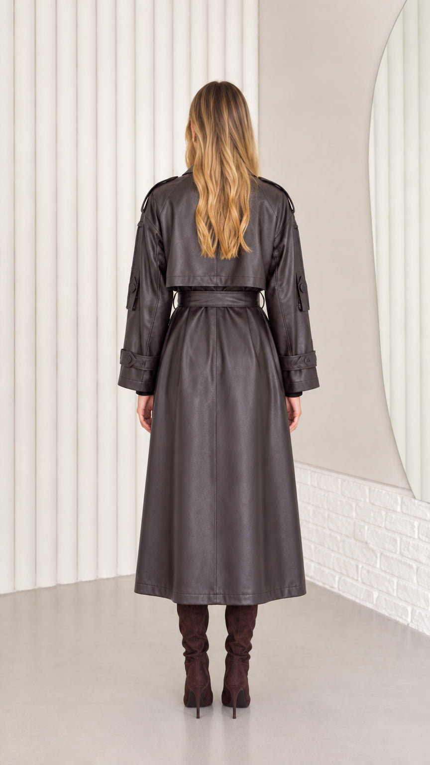 Back view of dark brown faux leather trench coat showing clean drape
