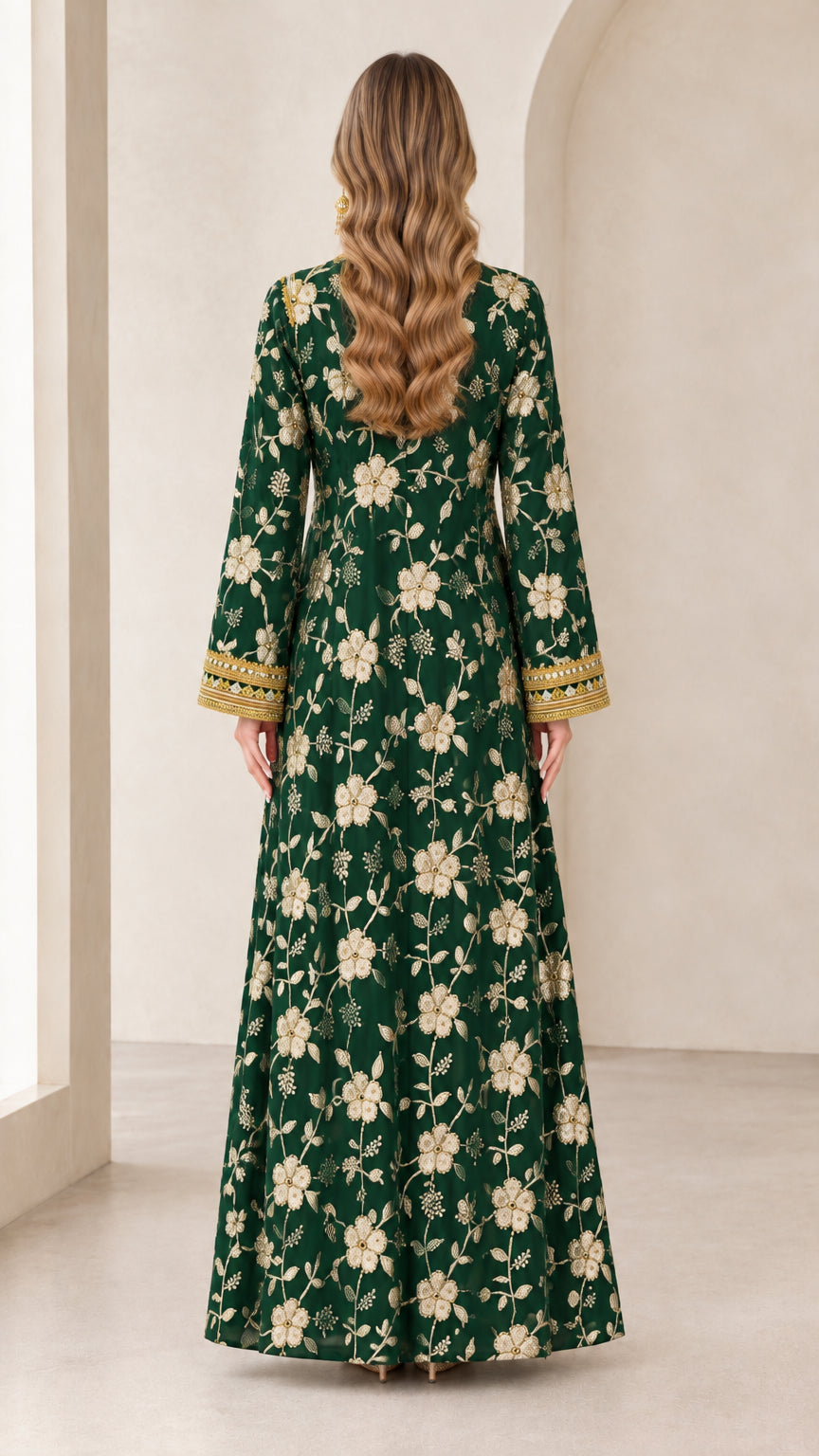 Back full view of woman in emerald green all-over floral embroidered maxi dress