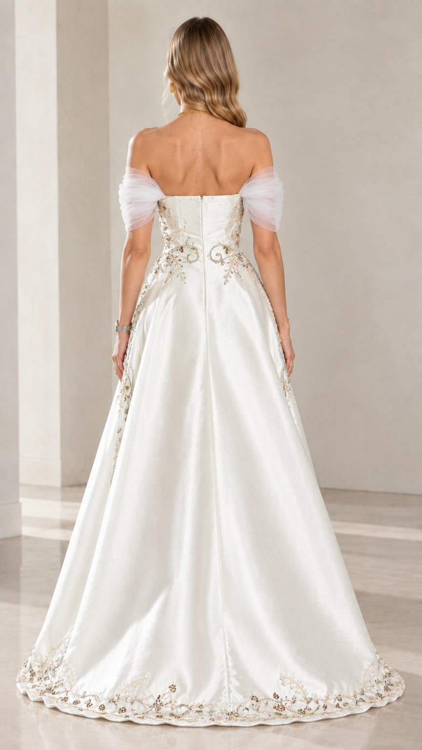 Back view of ivory satin evening dress with train and detailed hem embroidery