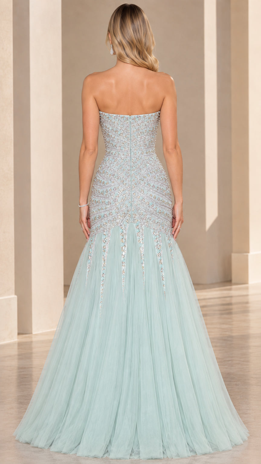 Back view of mint green strapless evening gown showing fitted back and flared tulle skirt