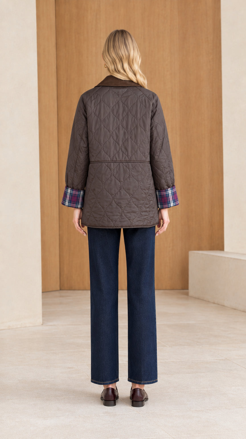 Back view of woman wearing dark brown diamond quilted field jacket