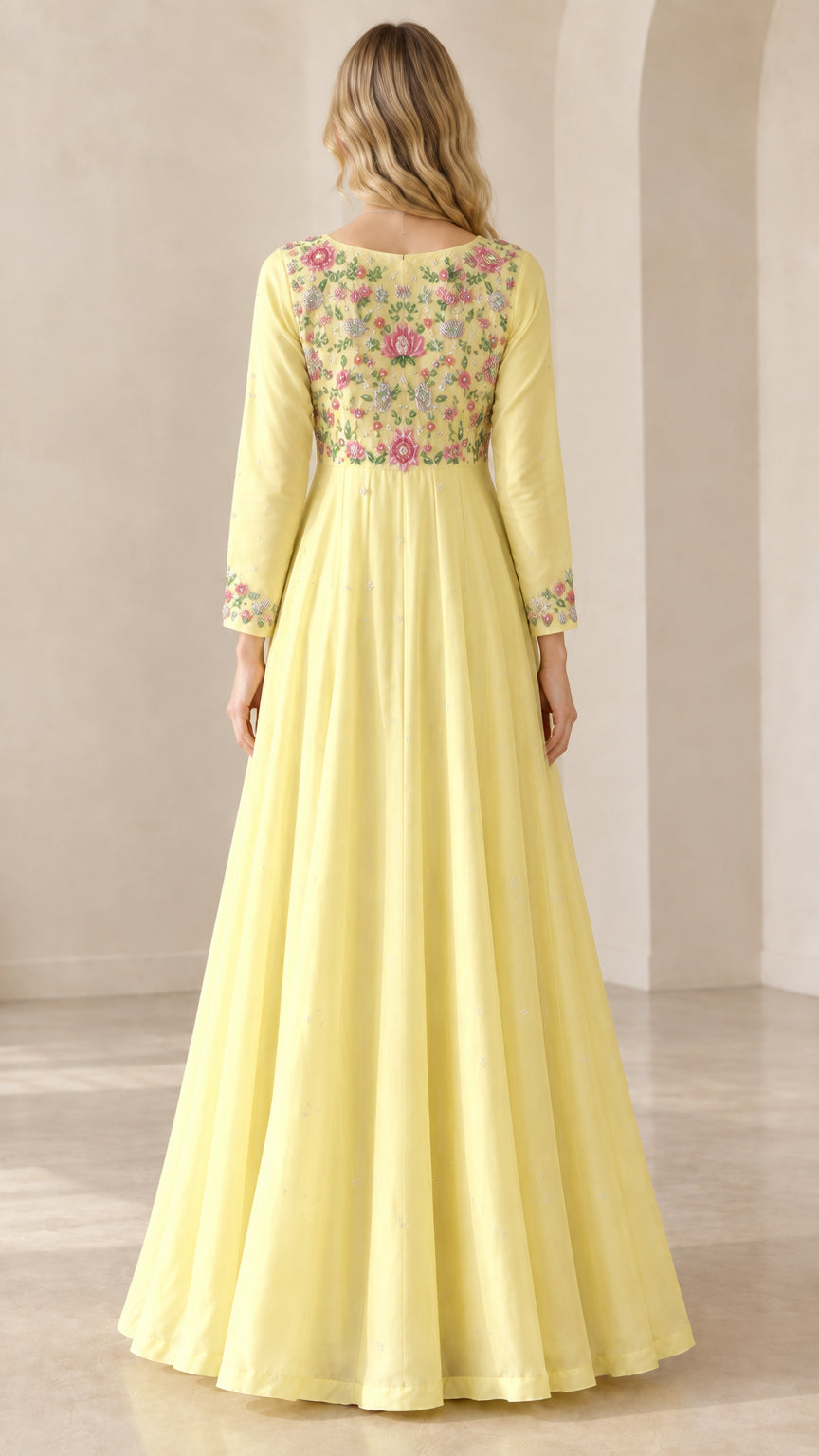 Back view of women's yellow maxi dress with embroidered bodice