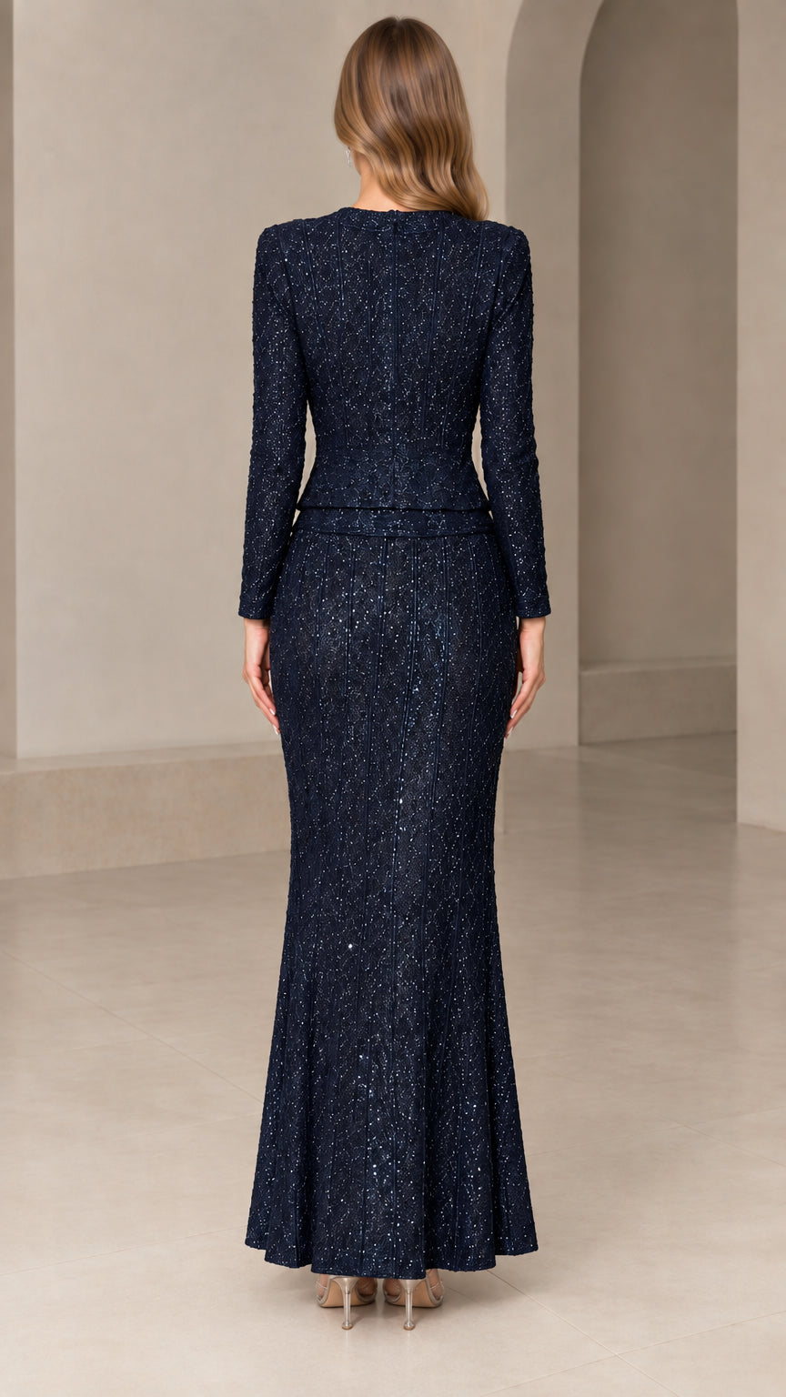 Back view of model in Navy Blue sequin long sleeve formal evening set