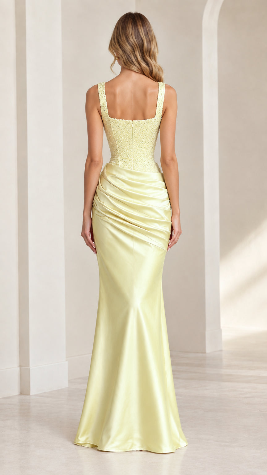Back view of model in pastel yellow floor-length satin formal dress
