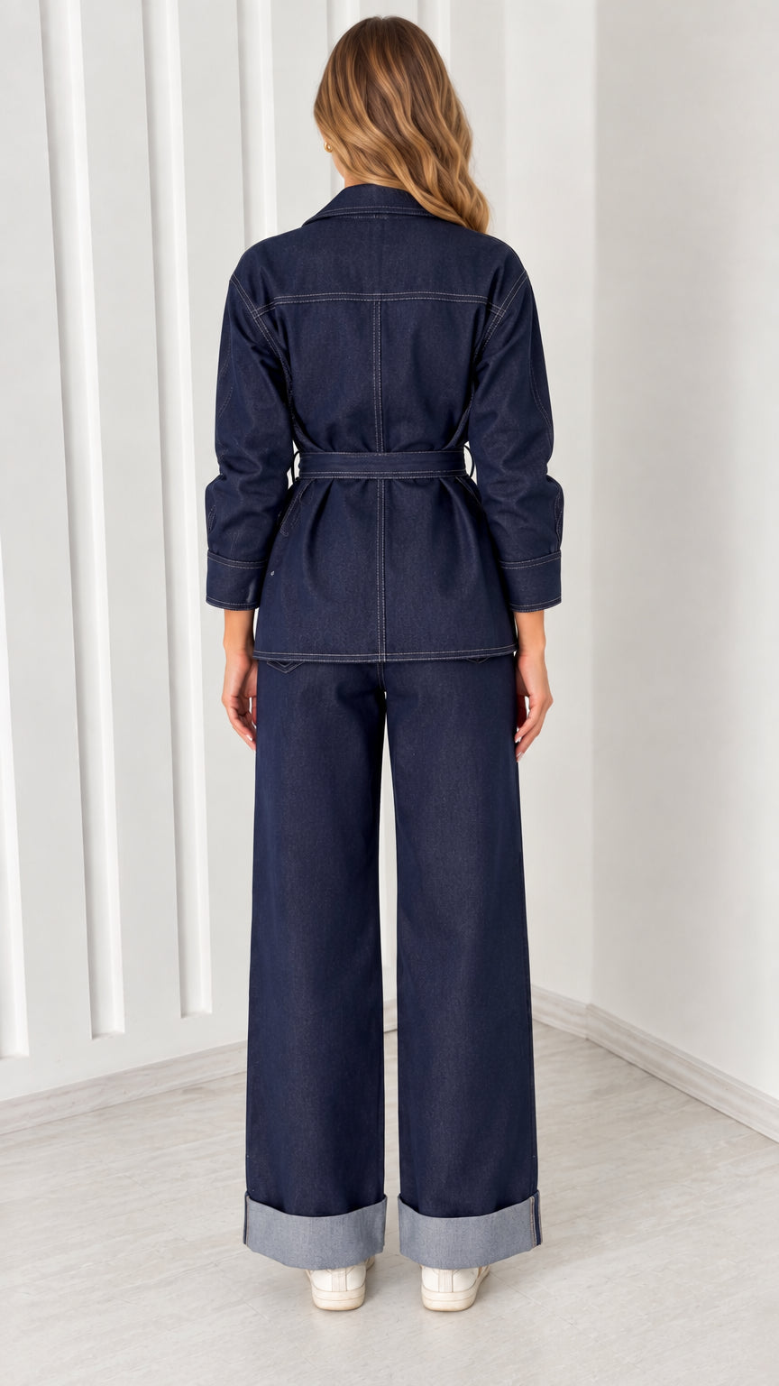 Back view of model wearing Dark Indigo belted jacket and wide-leg pants set