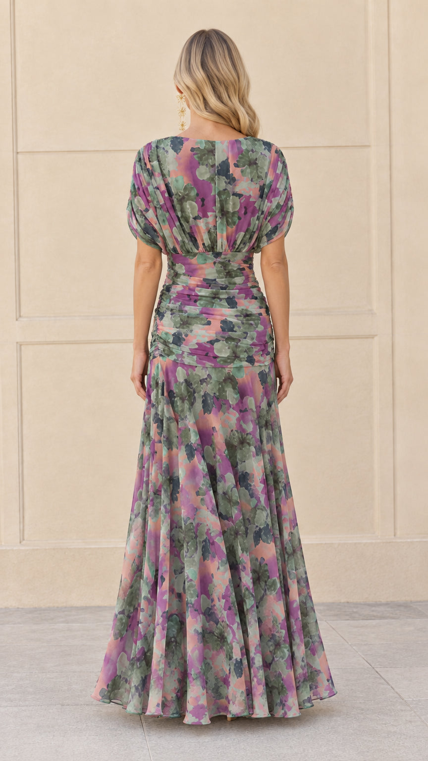 Back view of woman in sage purple floral printed chiffon maxi gown