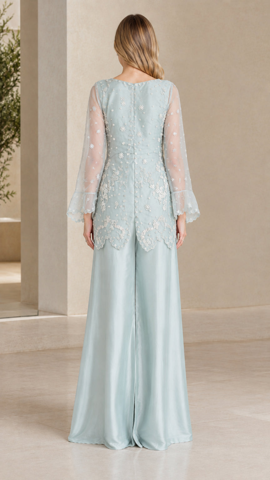 Back view of Light Blue formal two piece pant suit with embroidered tunic
