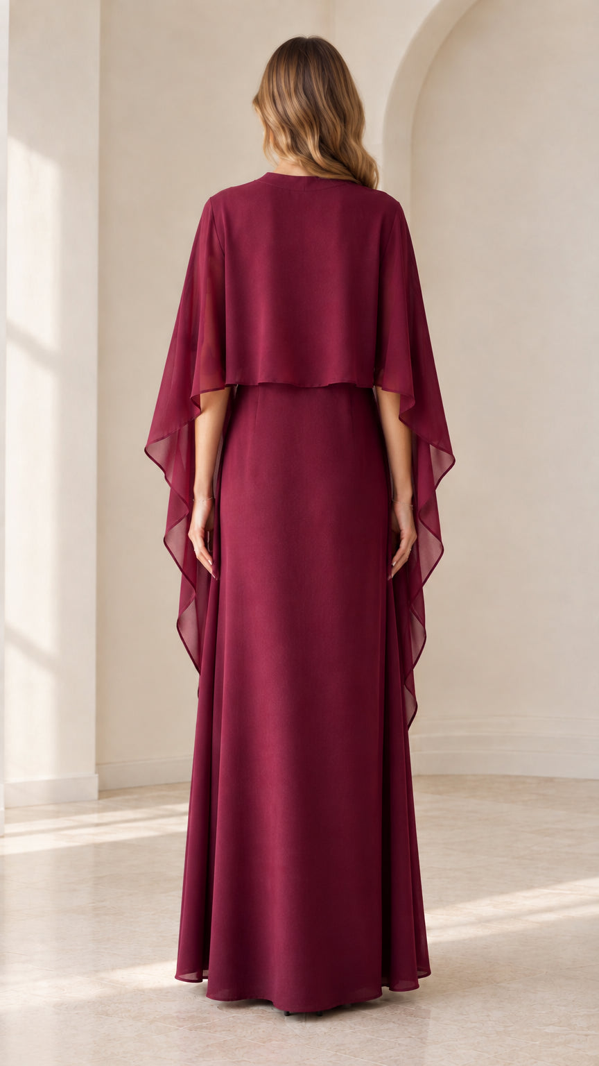 Back view of burgundy capelet maxi dress showing draped cape
