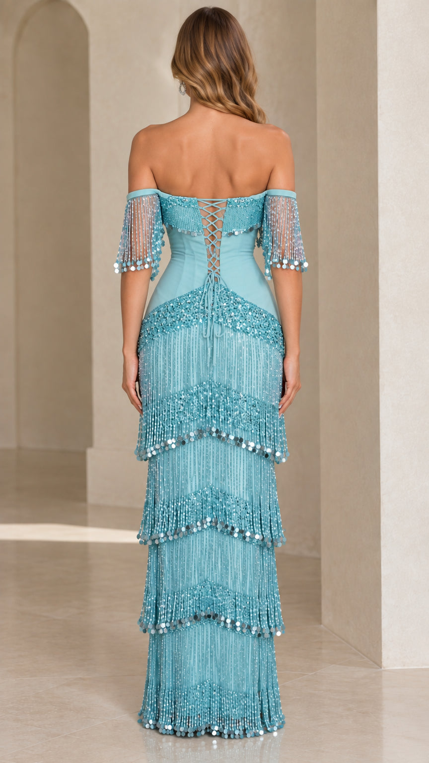Back view of aqua blue gown showing lace-up corset closure and tiered tassels