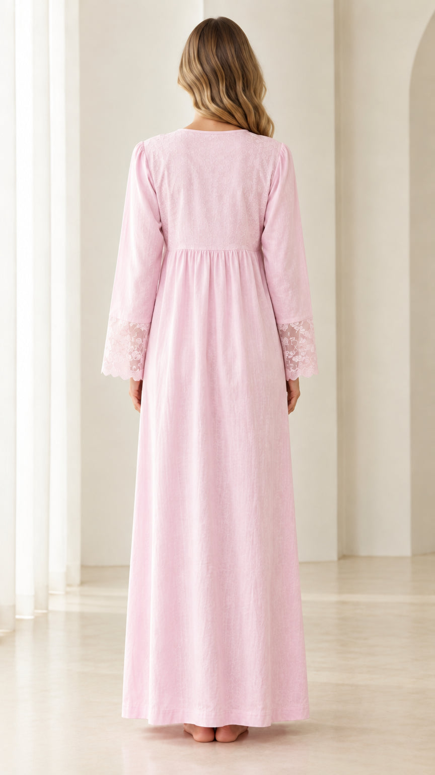 Back view of model in elegant long pink Victorian nightgown