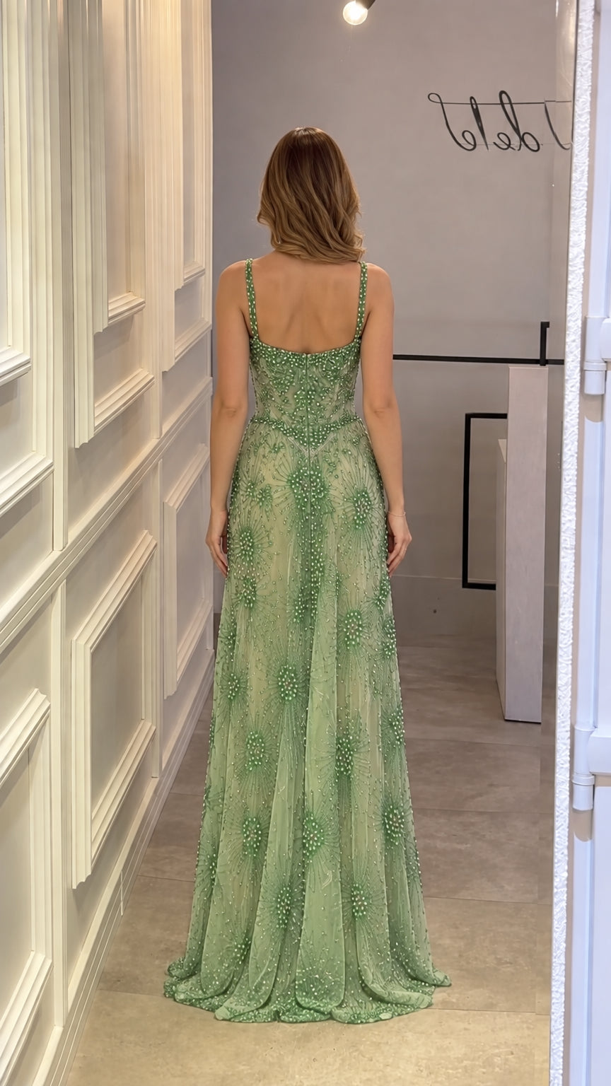 Back view of model in Sage Green beaded evening dress showing scoop back