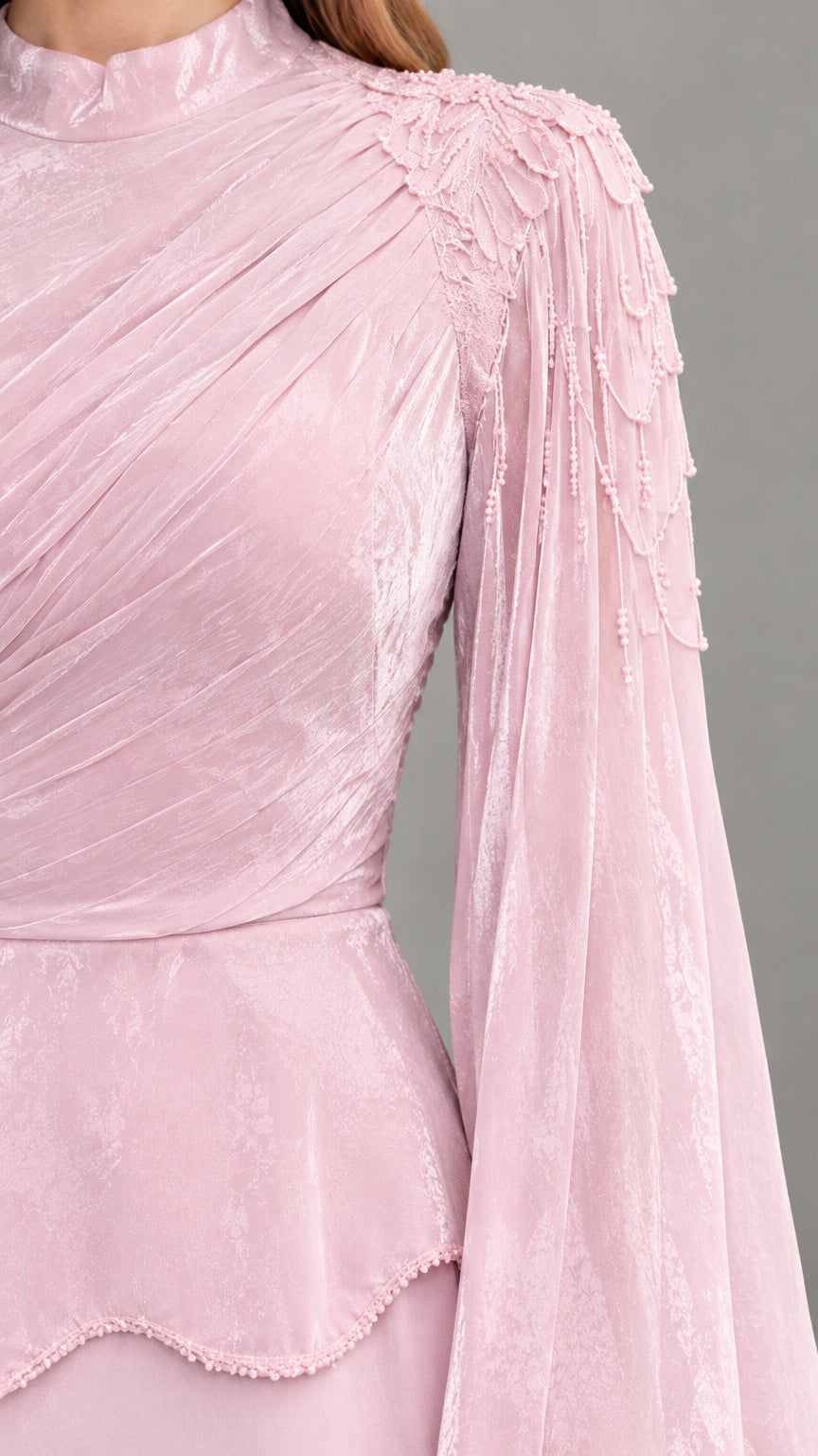Close-up of ruched high neckline and beaded shoulder embellishment