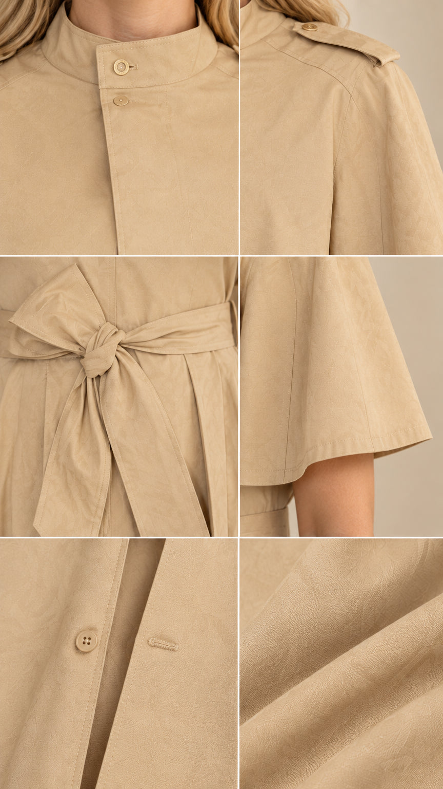 Close-up details of collar, shoulder tabs, waist tie belt, and fabric texture