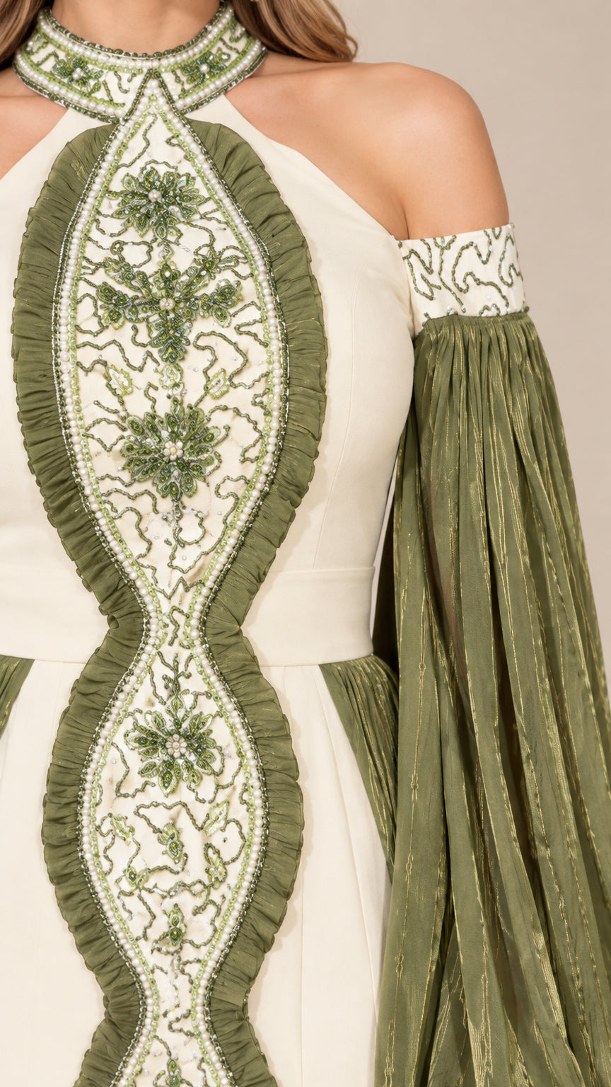Close-up detail of central floral beadwork embroidery and halter neckline