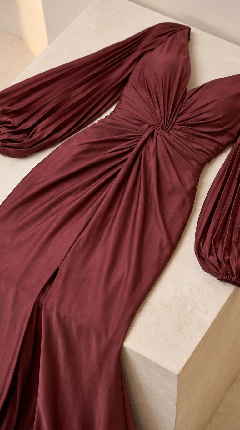 Close-up detail of Burgundy evening gown pleated sleeves and twist bodice