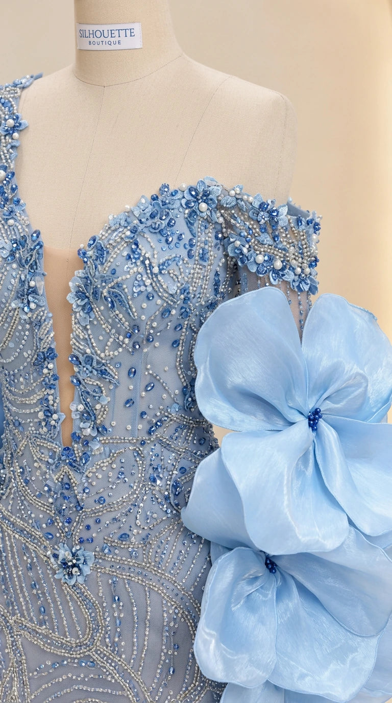 Close-up detail of bodice beadwork, illusion plunge neckline, and 3D floral ruffle sleeve in Light Blue