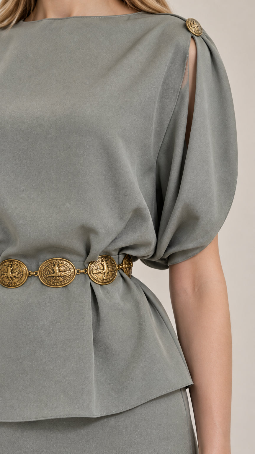 Close-up of sage green peplum bodice and gold coin belt detail