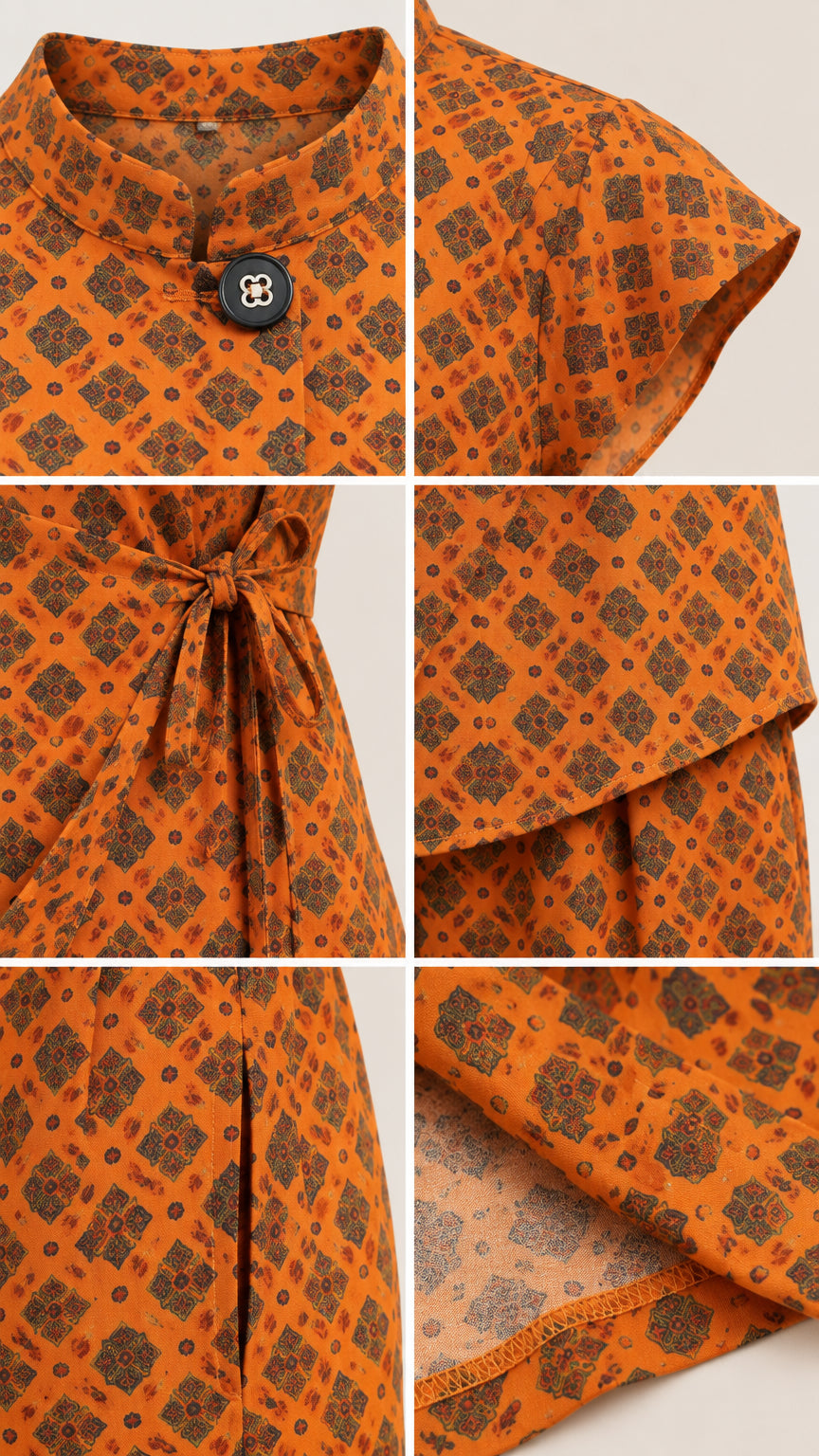 Close-up details of rust orange top featuring mandarin collar, button, cap sleeve, side tie, and fabric texture