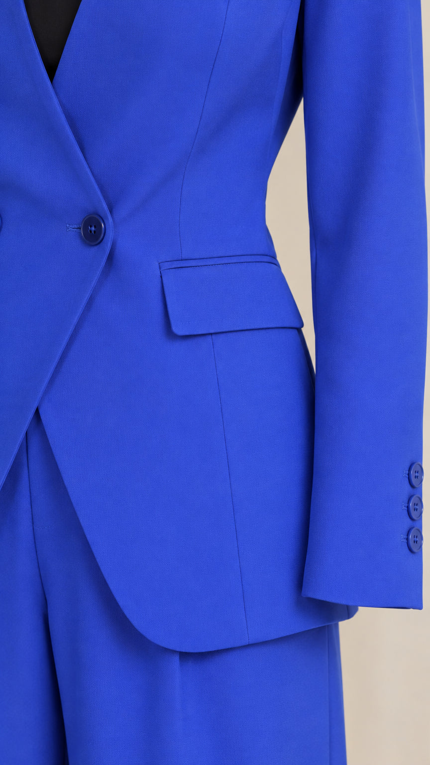 Close-up detail of Royal Blue single-button closure and flap pocket