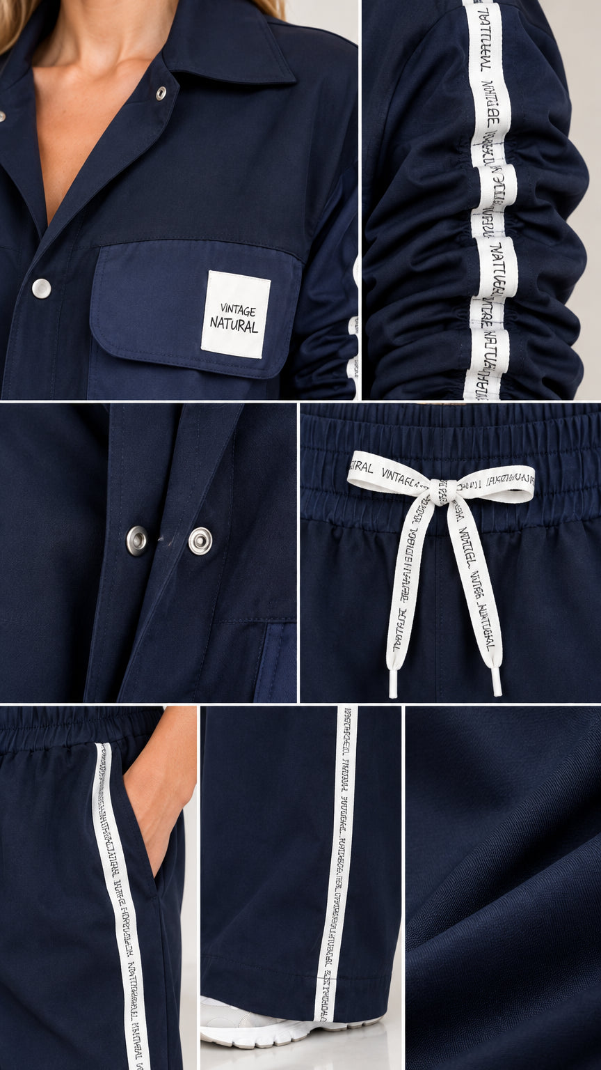 Close-up details of collar, snap buttons, drawstring waist, and side stripe typography