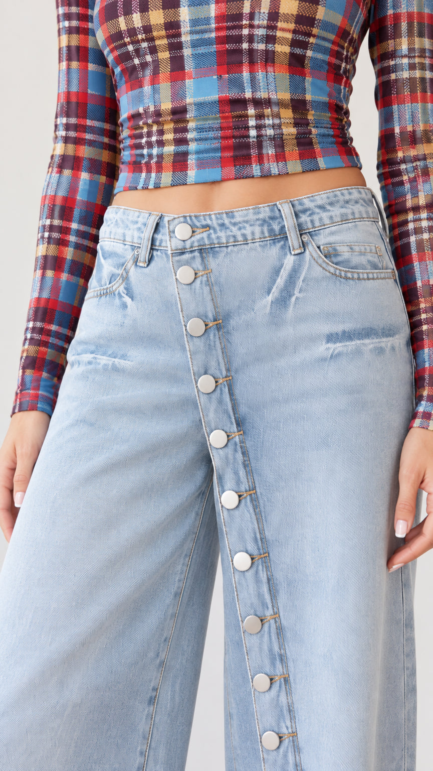 Close-up detail of Blue Plaid cropped top and high-rise button-front jeans