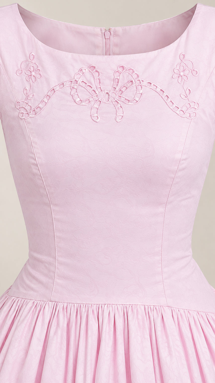 Close-up of Light Pink neckline showing detailed bow eyelet embroidery