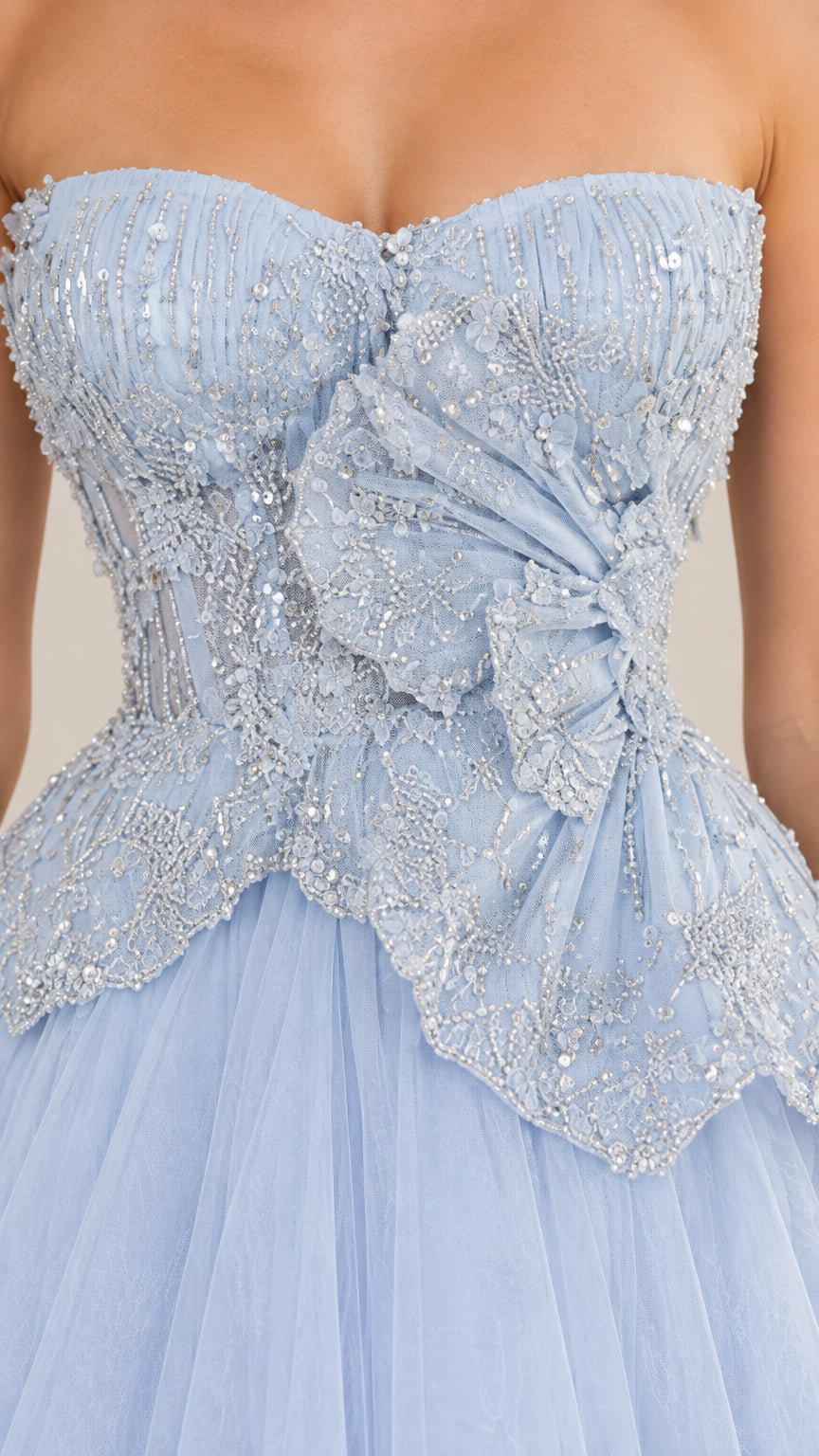 Close-up of light blue beaded sweetheart bodice with sculptural waist detail
