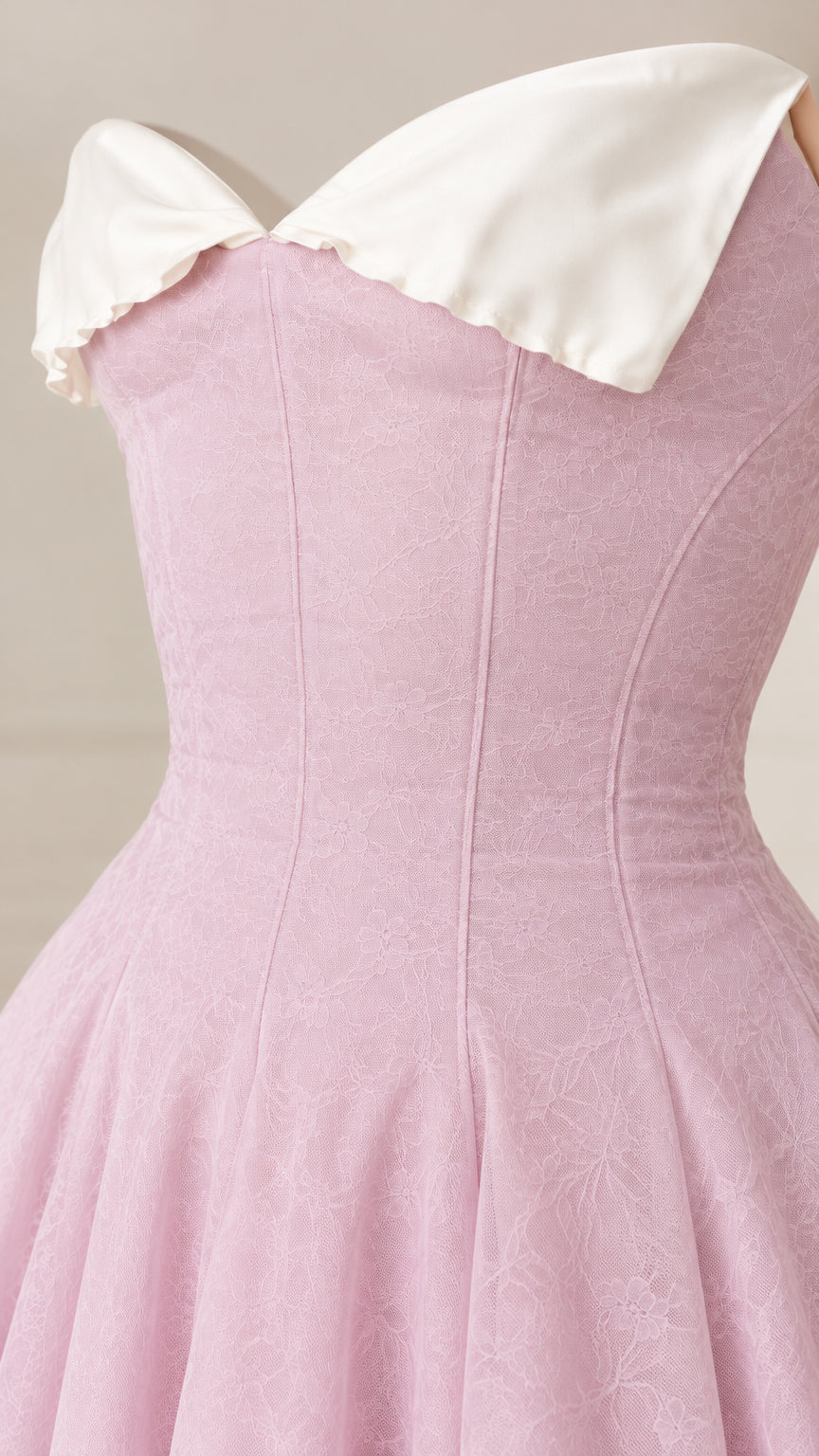 Close-up detail of structured Blush Pink bodice with white contrast foldover collar and textured jacquard finish