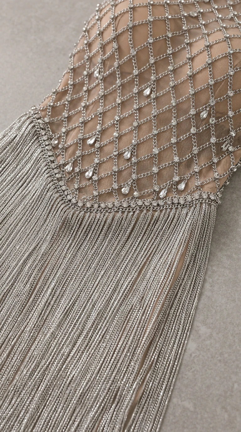 Close up detail of rhinestone lattice pattern and layered fringe trim