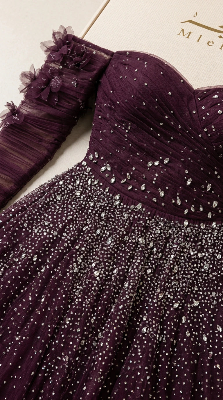 Close-up detail of ruched sweetheart bodice, beadwork, and 3D floral accents
