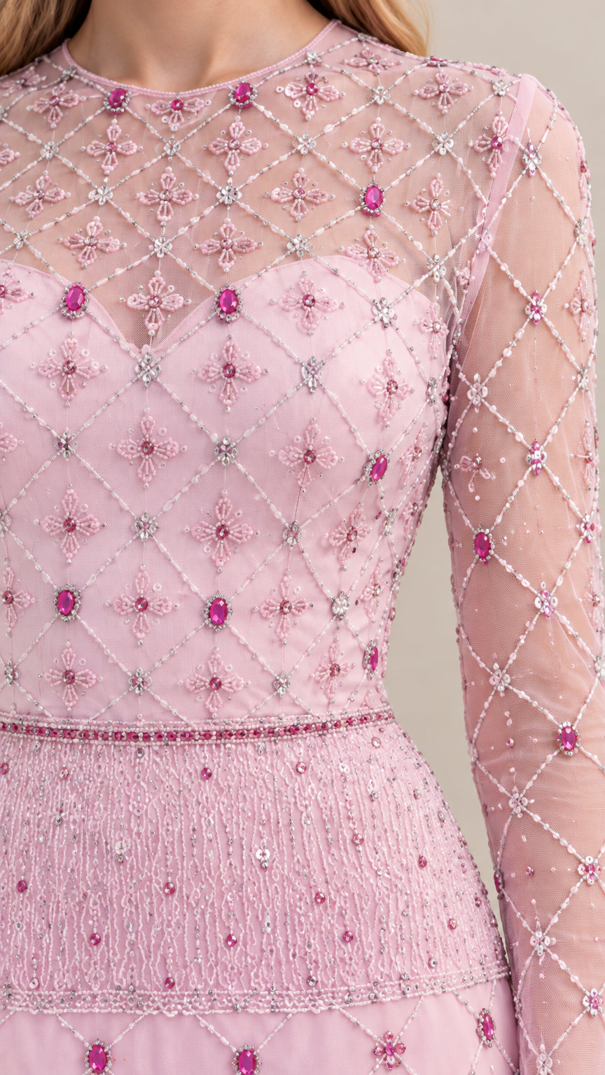 Close-up detail of blush pink illusion neckline and intricate crystal beadwork