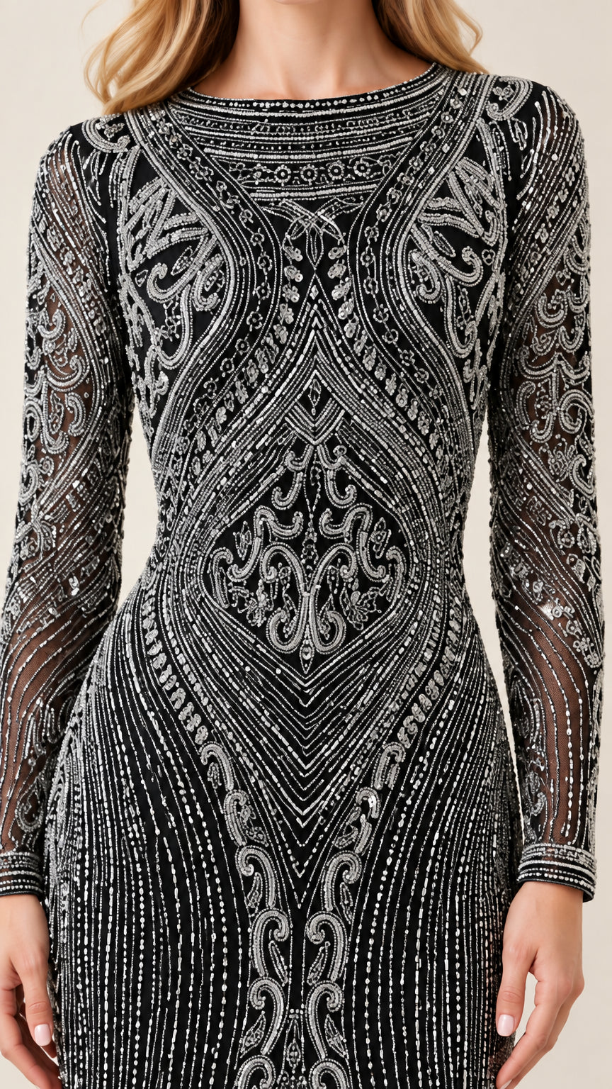Close-up of intricate silver beadwork and boat neckline on black gown