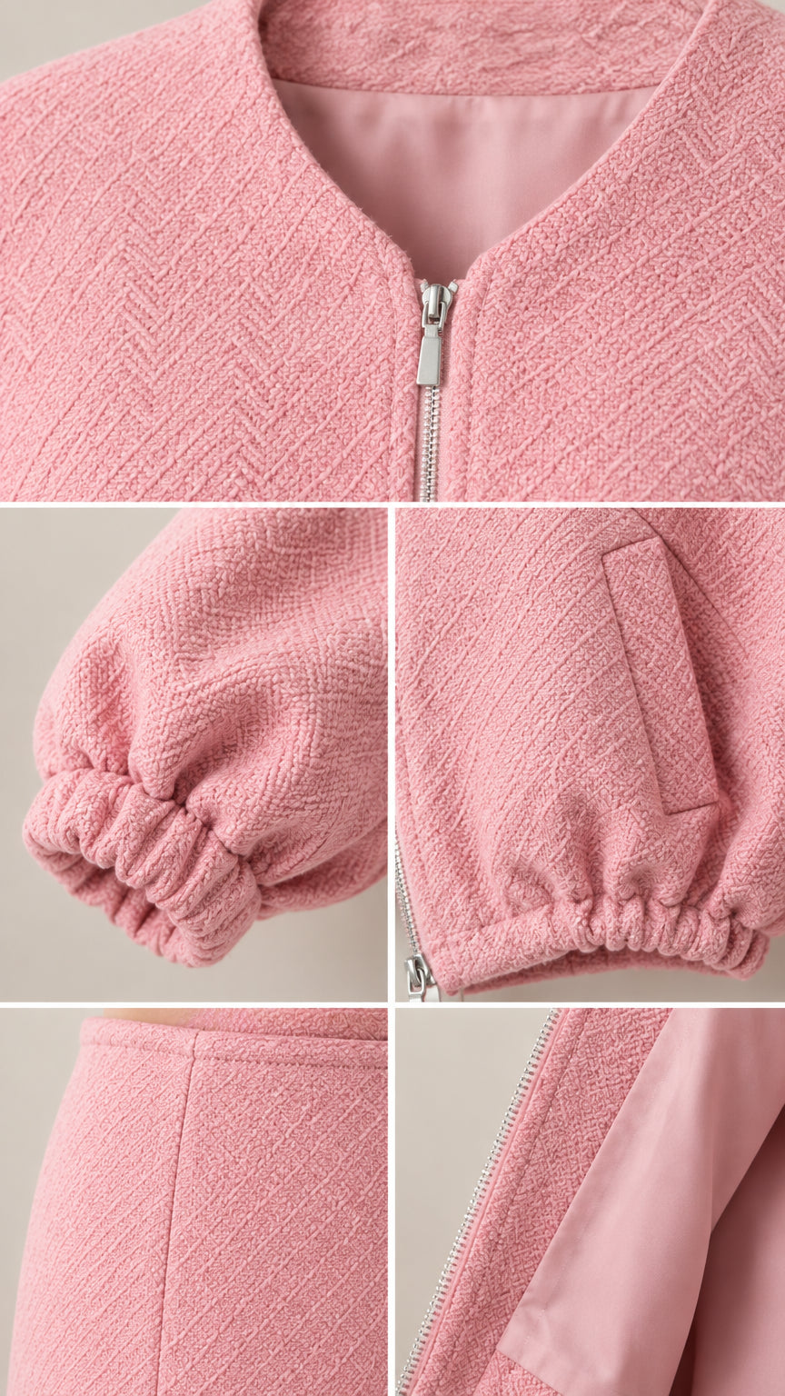 Close-up details of neckline zipper, cuff, and textured fabric on pink set
